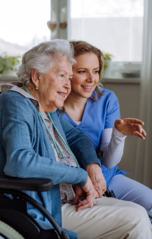 Portrait of nurse and her client on wheelchair
