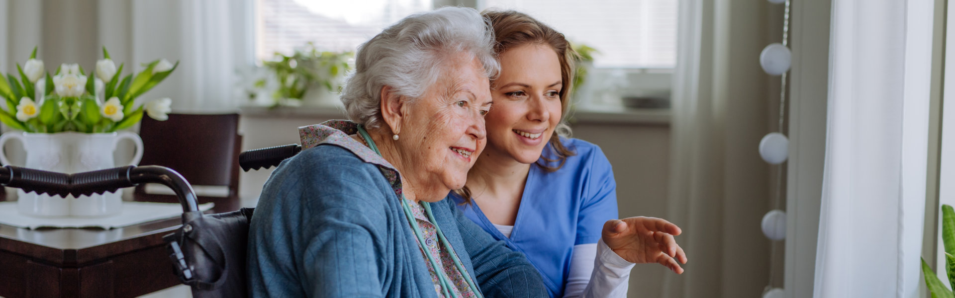 Portrait of nurse and her client on wheelchair